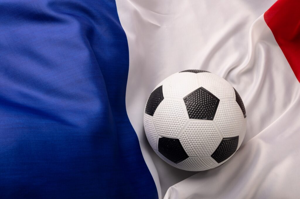 Composition of football over national flag of france